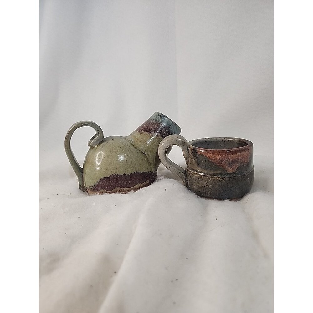 Pottery Cup And Pitcher.  S.T. initial On Both Items.  Pitcher Is Heavy